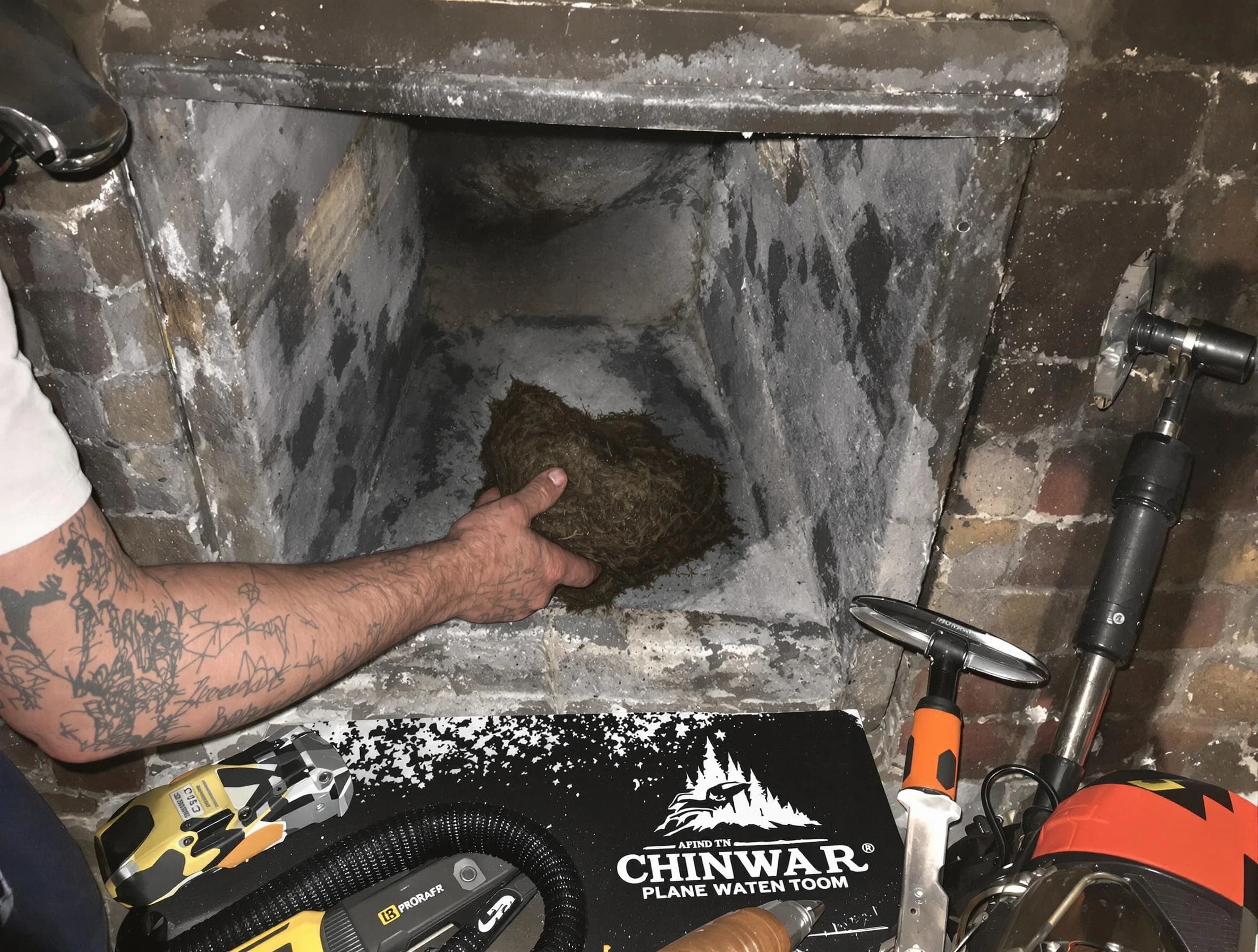 Lehi Chimney Sweep safely removing debris and screening chimney in Lehi, UT
